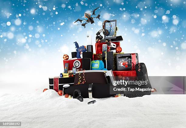 Selection of Apple iOS devices and accessories in a snowy Christmas scene photographed during a studio shoot for Tap Magazine, November 14, 2012.