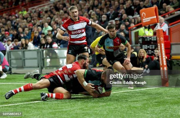 Sam Riley of Harlequins scores a tryduring their Premiership Rugby Cup match at Kingsholm Stadium on September 22, 2023 in Gloucester, England.