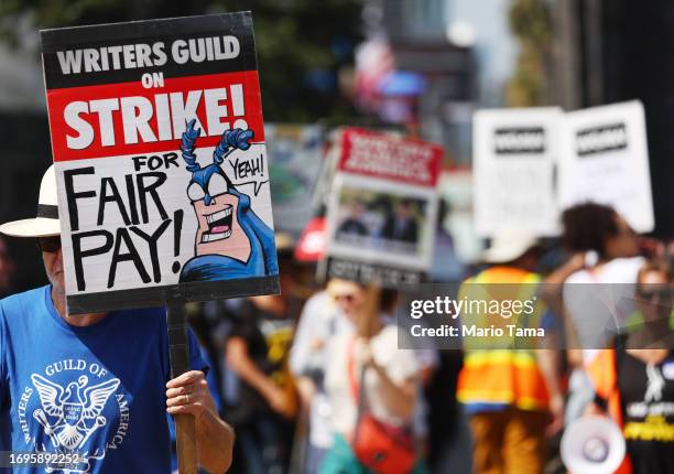 Striking WGA members picket with striking SAG-AFTRA members outside Netflix studios on September 22, 2023 in Los Angeles, California. The Writers...