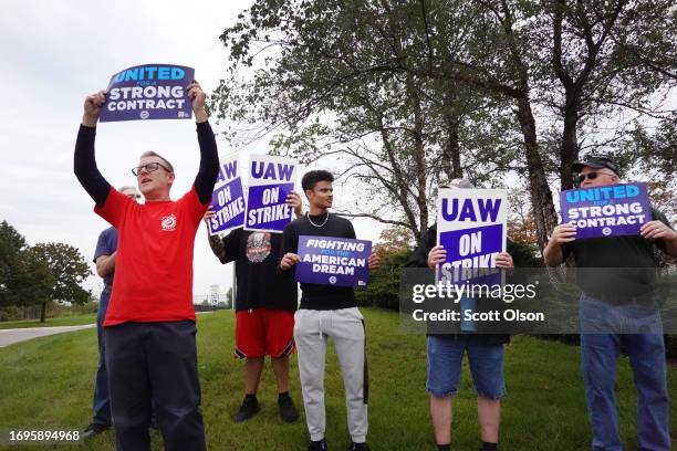 Workers picket outside of the General Motors parts facility on September 22, 2023 in Bolingbrook, Illinois. The United Auto Workers today expanded...