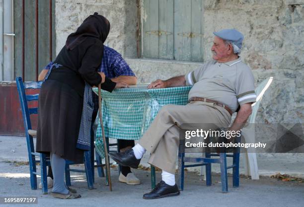 greek people at cafe table, crete, greece - greek worry beads stock pictures, royalty-free photos & images
