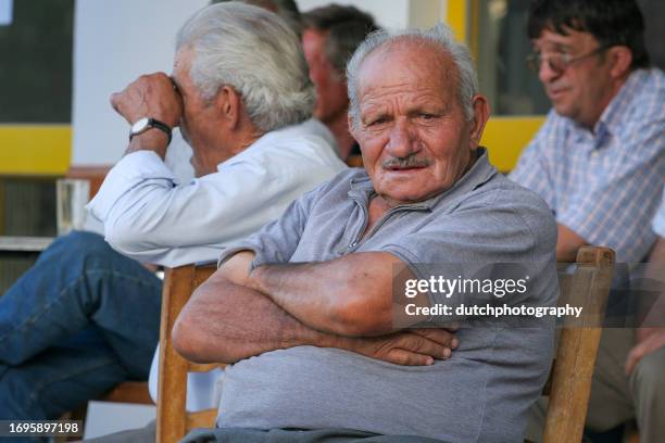 greek men at cafe table, naxos, greece - greek worry beads stock pictures, royalty-free photos & images