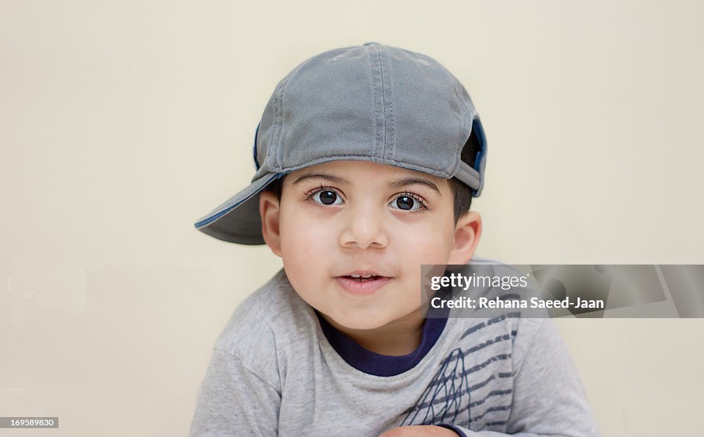 Boy wearing side cap