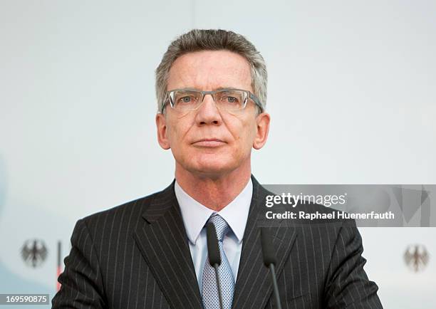 German Defence Minister Thomas de Maiziere and his dutch counterpart Jeanine Hennis-Plasschaert sign a memorandum of understanding on May 28, 2013 at...