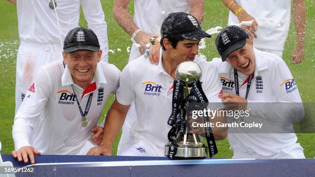 England captain Alastair Cook celebrates with Jonathan Bairstow and Joe Root after winning the 2nd Investec Test match between England and New...