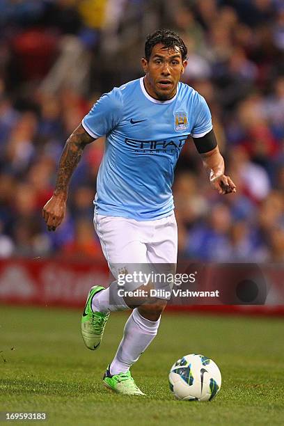 Carlos Tevez of Manchester City controls the ball against the Chelsea during a friendly match at Busch Stadium on May 23, 2013 in St. Louis, Missouri.