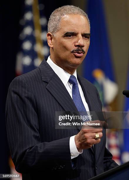 Attorney General Eric Holder speaks during a naturalization ceremony at the U.S. Department of Justice May 27, 2013 in Washington, DC. During the...