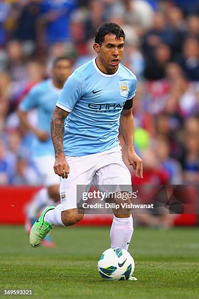 Carlos Tevez of Manchester City controls the ball against the Chelsea during a friendly match at Busch Stadium on May 23, 2013 in St. Louis, Missouri.