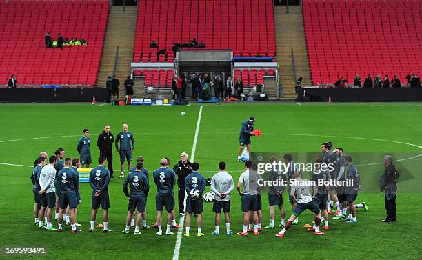 Giovanni Trapattoni the Republic of Ireland coach talks to the players during training ahead of their international friendly against England at...