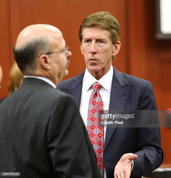Defense attorney Mark O'Mara talks to prosecutor Bernie de la Rionda during a pre-trial hearing May 28, 2013 in Sanford, Florida. George Zimmerman,...