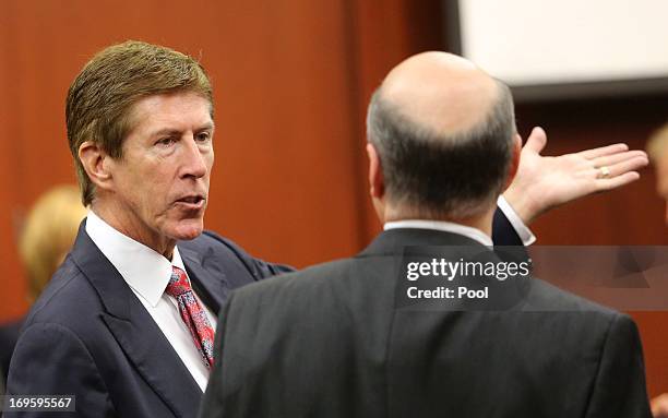 Defense attorney Mark O'Mara talks to prosecutor Bernie de la Rionda during a pre-trial hearing May 28, 2013 in Sanford, Florida. George Zimmerman,...