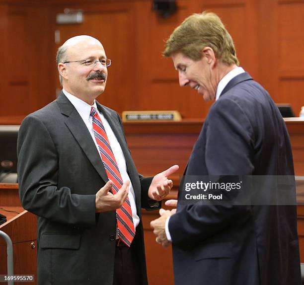 Prosecutor Bernie de la Rionda talks with defense attorney Mark O'Mara, during a pre-trial hearing May 28, 2013 in Sanford, Florida. George...