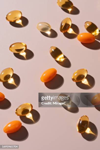various of softgel capsules flat lay - fish oil stock pictures, royalty-free photos & images