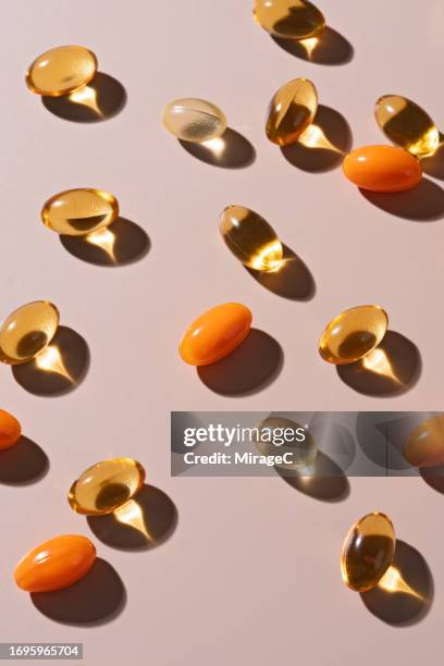 various of softgel capsules flat lay - fish oil imagens e fotografias de stock