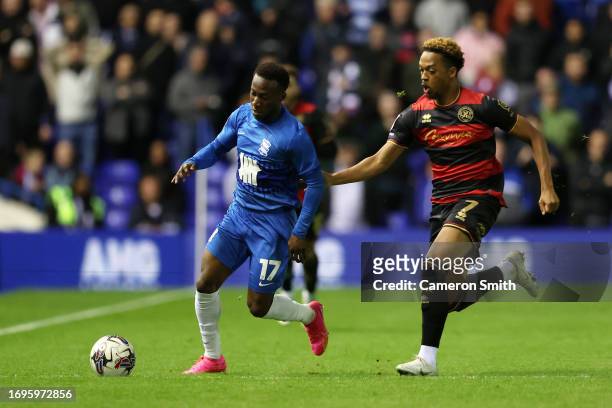 Siriki Dembele of Birmingham City is put under pressure by Chris Willock of Queens Park Rangers during the Sky Bet Championship match between...