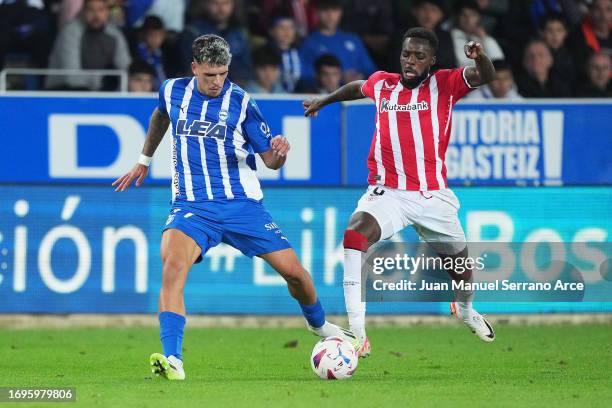 Javi Lopez of Deportivo Alaves is challenged by Inaki Williams of Athletic Club during the LaLiga EA Sports match between Deportivo Alaves and...