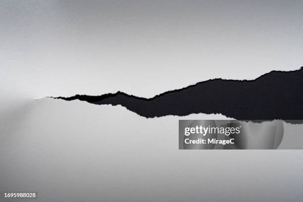 torn white paper on black background - tear stock pictures, royalty-free photos & images