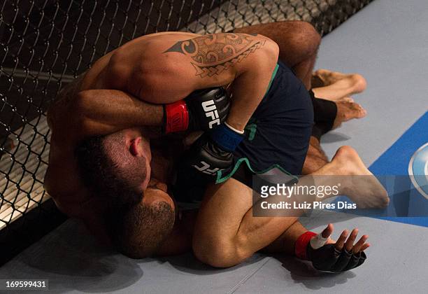 Santiago Ponzinibbio punches Cleiton "Foguete" Duarte in their quarterfinal fight during filming of season two of The Ultimate Fighter Brazil on...