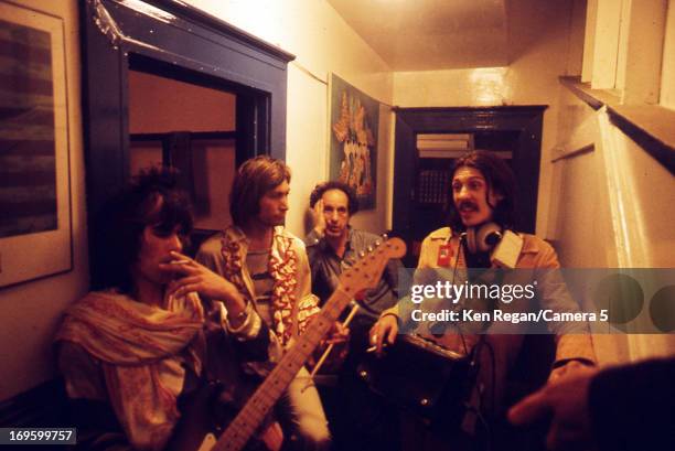 Keith Richards and Charlie Watts of the Rolling Stones are photographed backstage with Robert Frank in 1972 in Long Beach, California. CREDIT MUST...