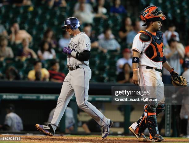 Troy Tulowitzki of the Colorado Rockies scores the go ahead run during the ninth inning against the Houston Astros at Minute Maid Park on May 28,...