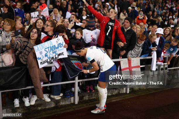 Lucy Bronze of England interacts with fans following their sides victory in the UEFA Women's Nations League match between England and Scotland at...