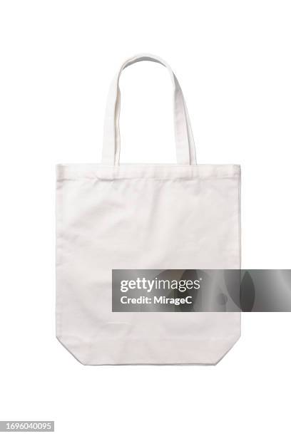 reusable blank white tote bag isolated on white - henkeltasche stock-fotos und bilder
