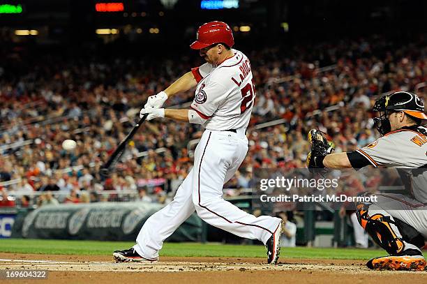 Adam LaRoche of the Washington Nationals hits a three run home run in the first inning during an interleague game against the Baltimore Orioles at...