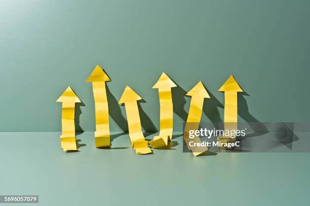 weak upward arrows - weakness stock pictures, royalty-free photos & images