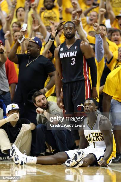 Lance Stephenson of the Indiana Pacers reacts after he made a 3-point basket in the second half against Dwyane Wade of the Miami Heat during Game...