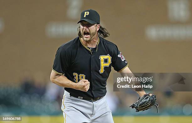 Jason Grilli of the Pittsburgh Pirates celebrates the final out in the eleventh inning during the game against the Detroit Tigers at Comerica Park on...