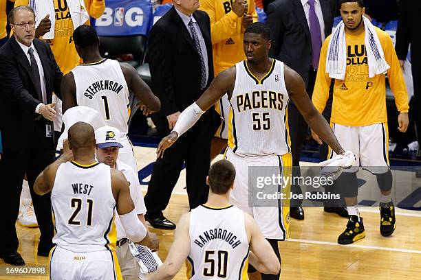 David West, Lance Stephenson, Tyler Hansbrough and Roy Hibbert of the Indiana Pacers celebrate with their teammates after they won 99-92 against the...
