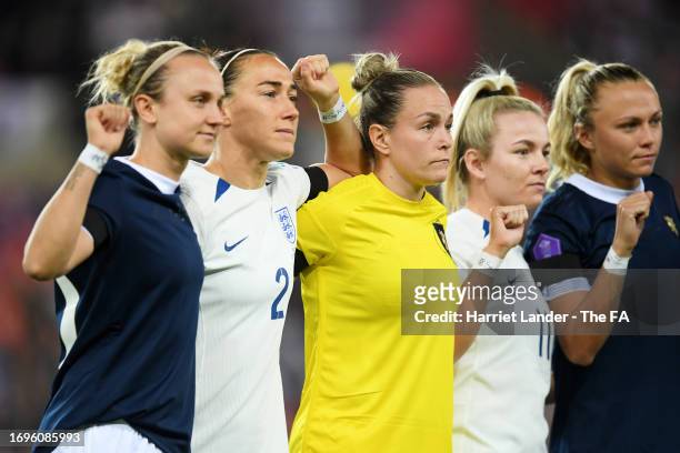 Martha Thomas of Scotland, Lucy Bronze of England, Lee Gibson of Scotland, Lauren Hemp of England and Claire Emslie of Scotland show support for the...