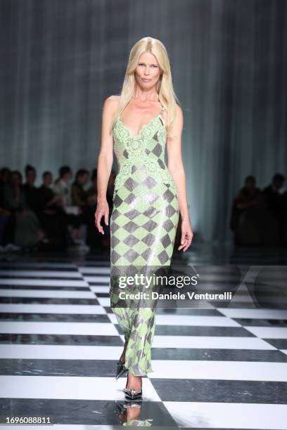 Claudia Schiffer walks the runway at the Versace fashion show during the Milan Fashion Week Womenswear Spring/Summer 2024 on September 22, 2023 in...