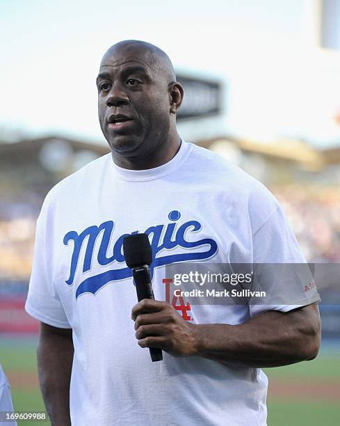 Los Angeles Dodger partner Earvin 'Magic' Johnson on the field during Magic Johnson T-Shirt night before the game between the Los Angeles Dodgers and...