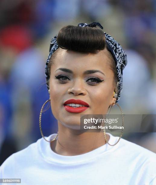 Recording Artist Andra Day sings the national anthem before the game between the Los Angeles Dodgers and the Los Angeles Angels of Anaheim at Dodger...