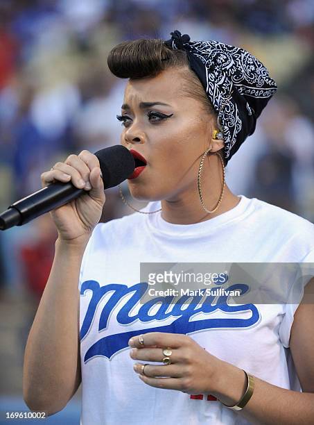 Recording Artist Andra Day sings the national anthem before the game between the Los Angeles Dodgers and the Los Angeles Angels of Anaheim at Dodger...
