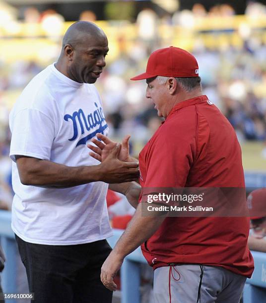 Los Angeles Dodger partner Earvin 'Magic' Johnson and Los Angeles Angels of Anaheim manager Mike Scioscia on the field during Magic Johnson T-Shirt...