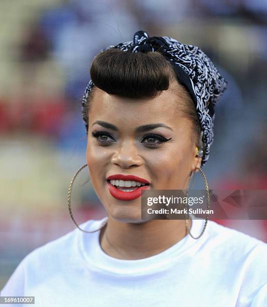 Recording Artist Andra Day sings the national anthem before the game between the Los Angeles Dodgers and the Los Angeles Angels of Anaheim at Dodger...