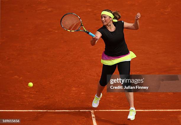 Aravane Rezai of France plays a forehand in her Women's Singles match against Petra Kvitova of Czech Republic during day four of the French Open at...