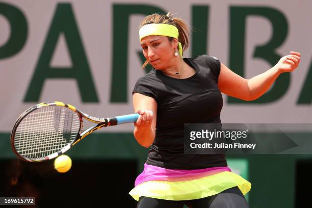 Aravane Rezai of France plays a forehand in her Women's Singles match against Petra Kvitova of Czech Republic during day four of the French Open at...