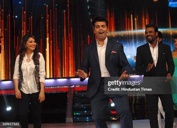 Bollywood actor Madhuri Dixit, filmmaker Karan Johar and choreographer Remo D'Souza during the first look of the dance reality show Jhalak Dikhla Jaa...