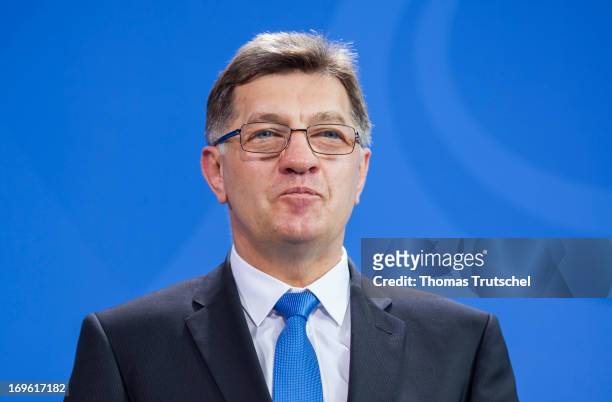 Lithuanian Prime Minister Algirdas Butkevicius is pictured during a press conference with German Chancellor Angela Merkel after their meeting at the...