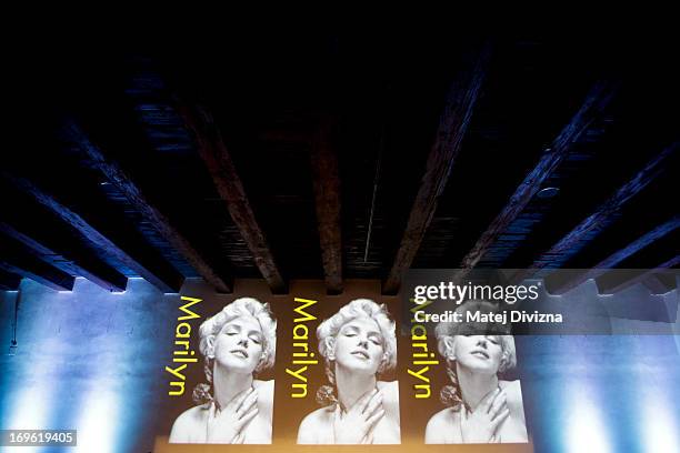 Screening of Marylin Monroe's photo is seen before a press conference during a press preview of the 'Marilyn' exhibition at Prague Castle on May 29,...