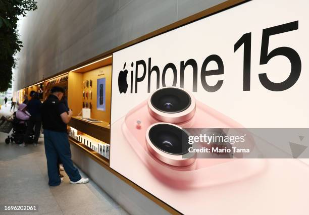 An advertisement for the new Apple iPhone 15 models is displayed in the Apple The Grove store on the phone’s worldwide release day on September 22,...