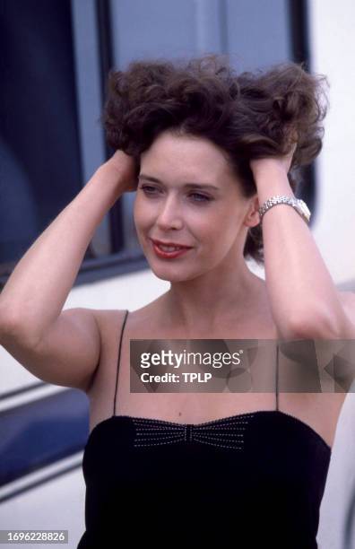 Dutch actress Sylvia Kristel holds her hair up in New York, New York, circa 1980.
