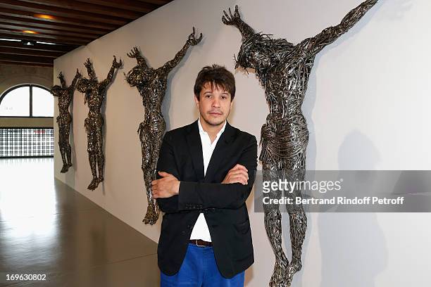 The artist Adel Abdessemed stands forward his 'Decor' at the Opening of the Fondazione Pinault, Punta della Dogana on May 29, 2013 in Venice, Italy.