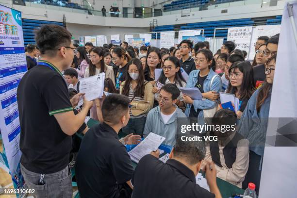 Students attend a job fair for graduates at Zhengzhou University on September 22, 2023 in Zhengzhou, Henan Province of China.