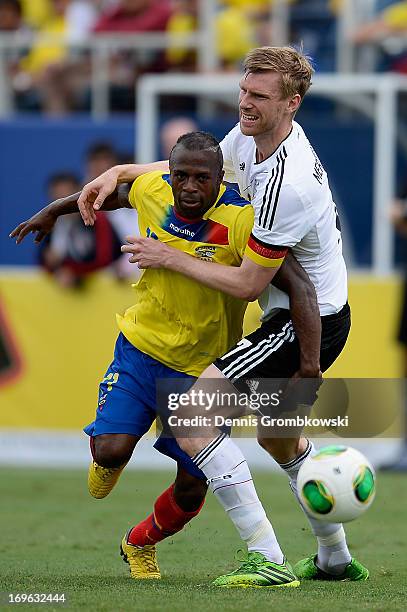 Christian Benitez of Ecuador is challenged by Per Mertesacker of Germany during the International Friendly match between Ecuador and Germany at FAU...