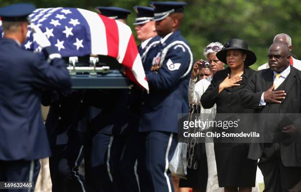Family and friends of U.S. Air Force Colonel Ruth Lucas' watch as her flag-draped casket is carried to the grave during her full military honors...
