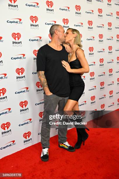 Brian Austin Green and Sharna Burgess attend the 2023 iHeartRadio Music Festival at T-Mobile Arena on September 22, 2023 in Las Vegas, Nevada.